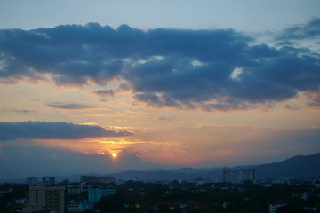 beautiful dramatic sunset sky above the city skyline