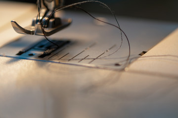 Sewing machine. Detail on thread and needle.