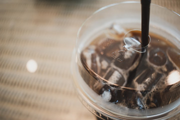 recycle sign on cup of iced coffee