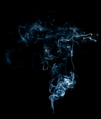 White smoke swirls on black background