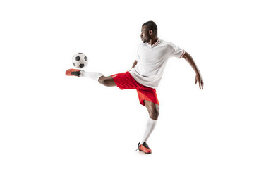 Obraz na płótnie Canvas Professional african american football soccer player in motion isolated on white studio background. Fit jumping man in action, jump, movement at game.