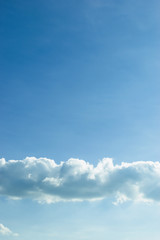 fluffy cloud above clear blue sky
