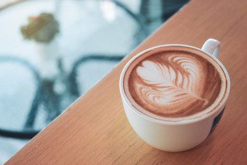 hot coffee drink in cafe, heart of latte art in cup