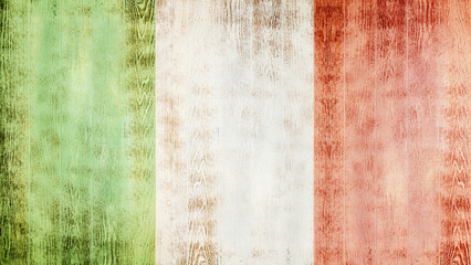 Fototapeta premium Flag of Italy on white wooden planks