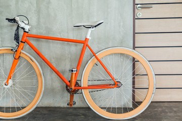 Fototapeta na wymiar orange bicycle parked decorate interior living room modern style