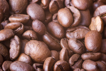 Roasted coffee beans, closeup. Background with blurred background.