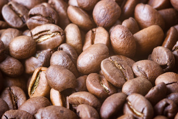 Roasted coffee beans, closeup. Background with blurred background.