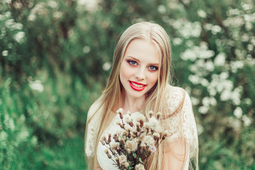 Fototapeta premium Close up natural portrait of young happy cute cheerful caucasian beautiful girl witn long natural blondie hair walking in park in summer evening