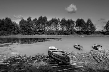 Black and white landscape with boats