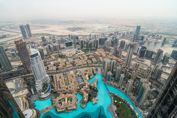 Fototapeta na wymiar DUBAI, UAE - October, 2018: Top view of Dubai urban skyline from Burj Khalifa. Dubai city view from the top of Burj Khalifa