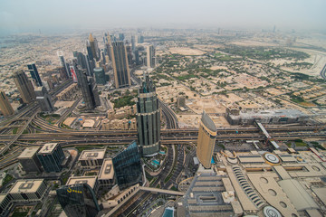 Fototapeta na wymiar DUBAI, UAE - October, 2018: Top view of Dubai city view from the above of Burj Khalifa