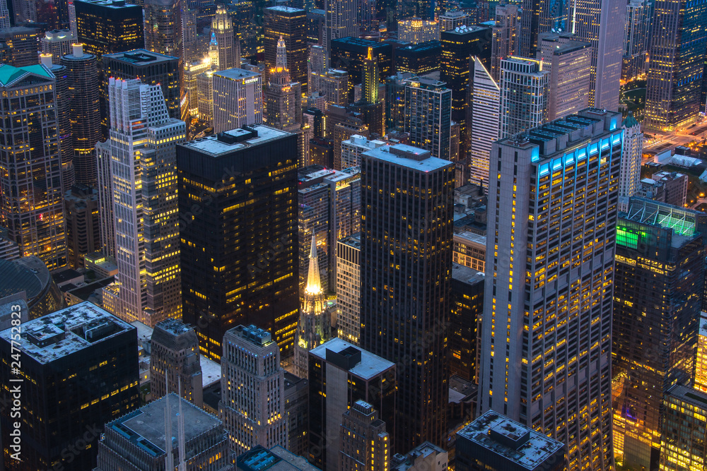 Wall mural chicago. cityscape image of chicago downtown during twilight blue hour.