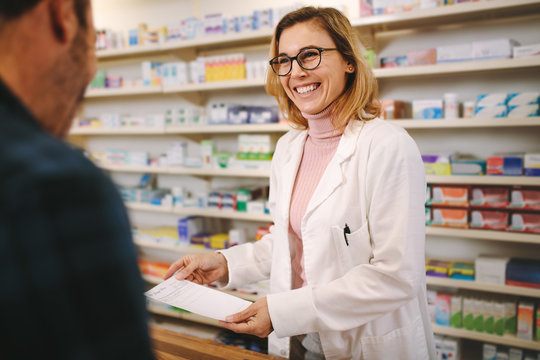 Helpful pharmacist dealing with a customer