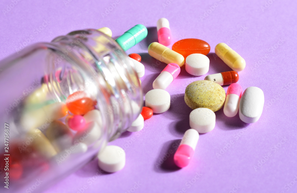 Wall mural pills and glass jar with pills outside