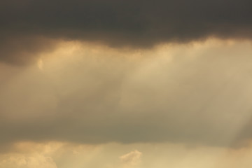 Fototapeta na wymiar sunlight through cloud on dramatic sky after the rain