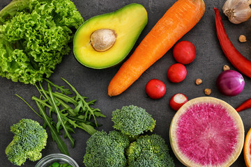 Fresh ingredients for vegetable salad on table. Diet food