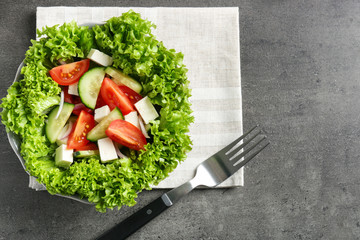Plate with fresh vegetable salad on table. Diet food © Pixel-Shot