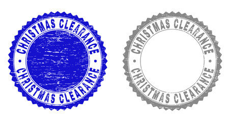Grunge CHRISTMAS CLEARANCE stamp seals isolated on a white background. Rosette seals with grunge texture in blue and grey colors.