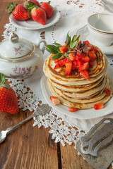 Strawberry chocolate pancakes on a vintage table