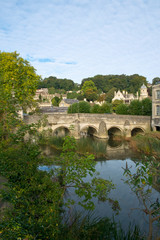 Fototapeta na wymiar The well known ancient bridge over the River Avon with its one-time chapel and later lock-up in autumn sunshine, Bradford on Avon, Wiltshire, UK