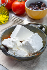 Fresh young soft white Feta cheese in bowl