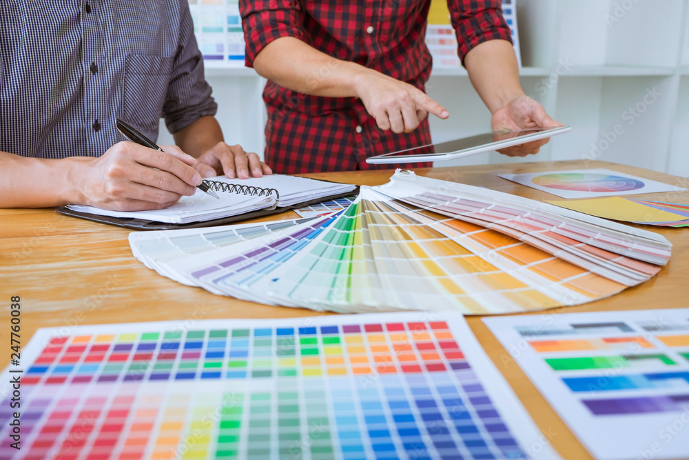 Poster teamwork of young creative designers working on project together and choose color swatch samples for