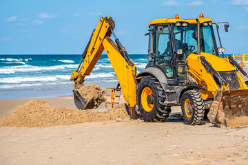 15/12/2018 Israel, Netanya, the driver of the excavator runs a bucket of manipulator, performs the...