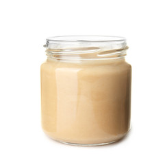 Jar of tasty tahini on white background
