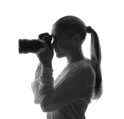 Portrait of beautiful photographer on white background