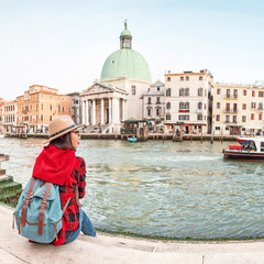 Happy asian woman travels in Venice. Great View on the famous tourist landmark Grand canal. Italy vacation concept