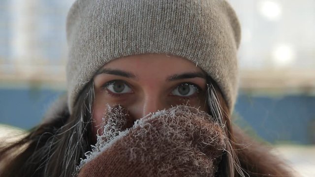 Close-up of the frozen woman's face.