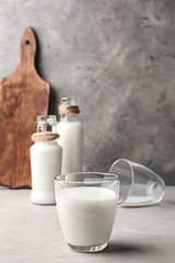 Glass of fresh milk on light table