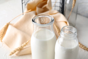 Bottles of fresh milk on light table