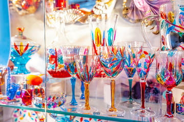 Colorful decorated objects made of a famous murano glass in a shop window in Venice - obrazy, fototapety, plakaty