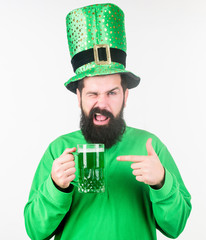 Irish tradition. Man brutal bearded hipster drink pint beer. Irish pub. Green beer mug. Drinking...