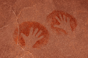 image of handprints on the cave wall. history of antiquities, archeology.