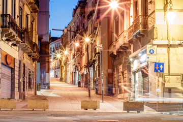 morning streets with lanterns and cafes in Cagliari Italy