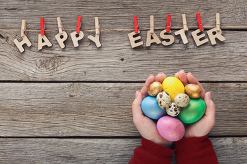 Easter greetings on wooden background