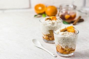 Overnight oats with tangerines and almonds. Selective focus, space for text.