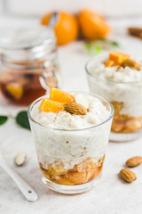 Healthy vanilla  oatmeal porridge with fresh fruit and nuts. Selective focus, space for text.