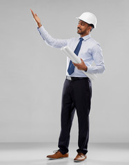 architecture, construction business and building - smiling indian architect or businessman in...