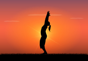 Obraz na płótnie Canvas Silhouette of woman doing yoga at sunset