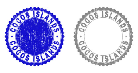 Grunge COCOS ISLANDS watermarks isolated on a white background. Rosette seals with grunge texture in blue and gray colors. Vector rubber stamp imprint of COCOS ISLANDS title inside round rosette.