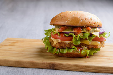 Burger with chicken and vegetables