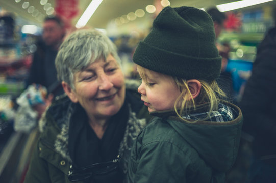 Toddler and grandmother in supermarket