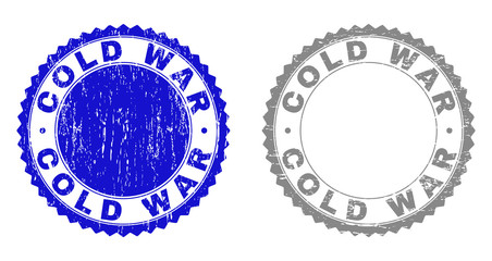 Obraz premium Grunge COLD WAR stamp seals isolated on a white background. Rosette seals with distress texture in blue and gray colors. Vector rubber overlay of COLD WAR label inside round rosette.