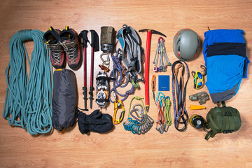 .climbing equipment on a wooden background before travel