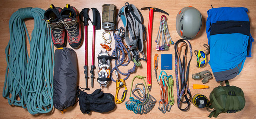 .climbing equipment on a wooden background before travel