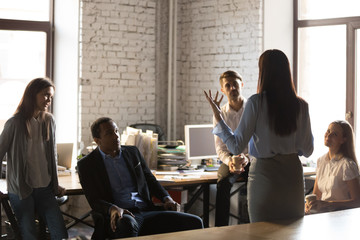 Confident female team leader hold casual meeting