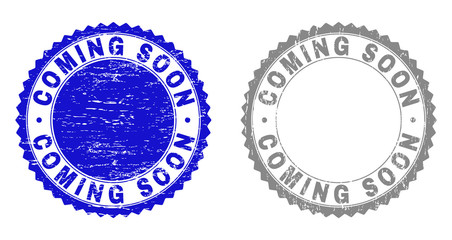 Grunge COMING SOON stamp seals isolated on a white background. Rosette seals with grunge texture in blue and gray colors. Vector rubber stamp imitation of COMING SOON title inside round rosette.